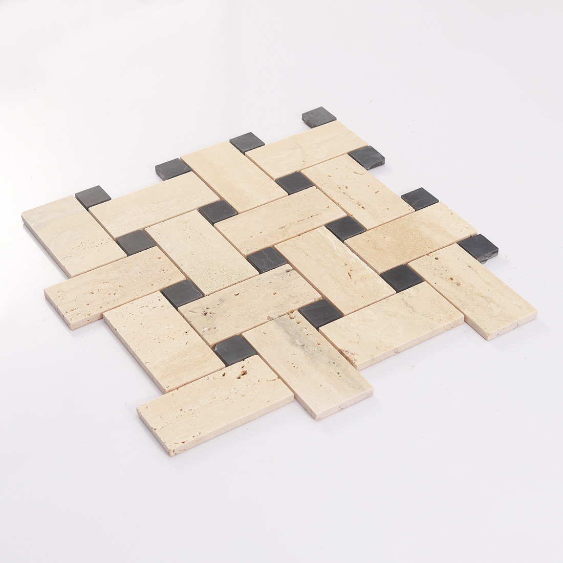 Side view of beige travertine basketweave mosaic tile with raised black dots