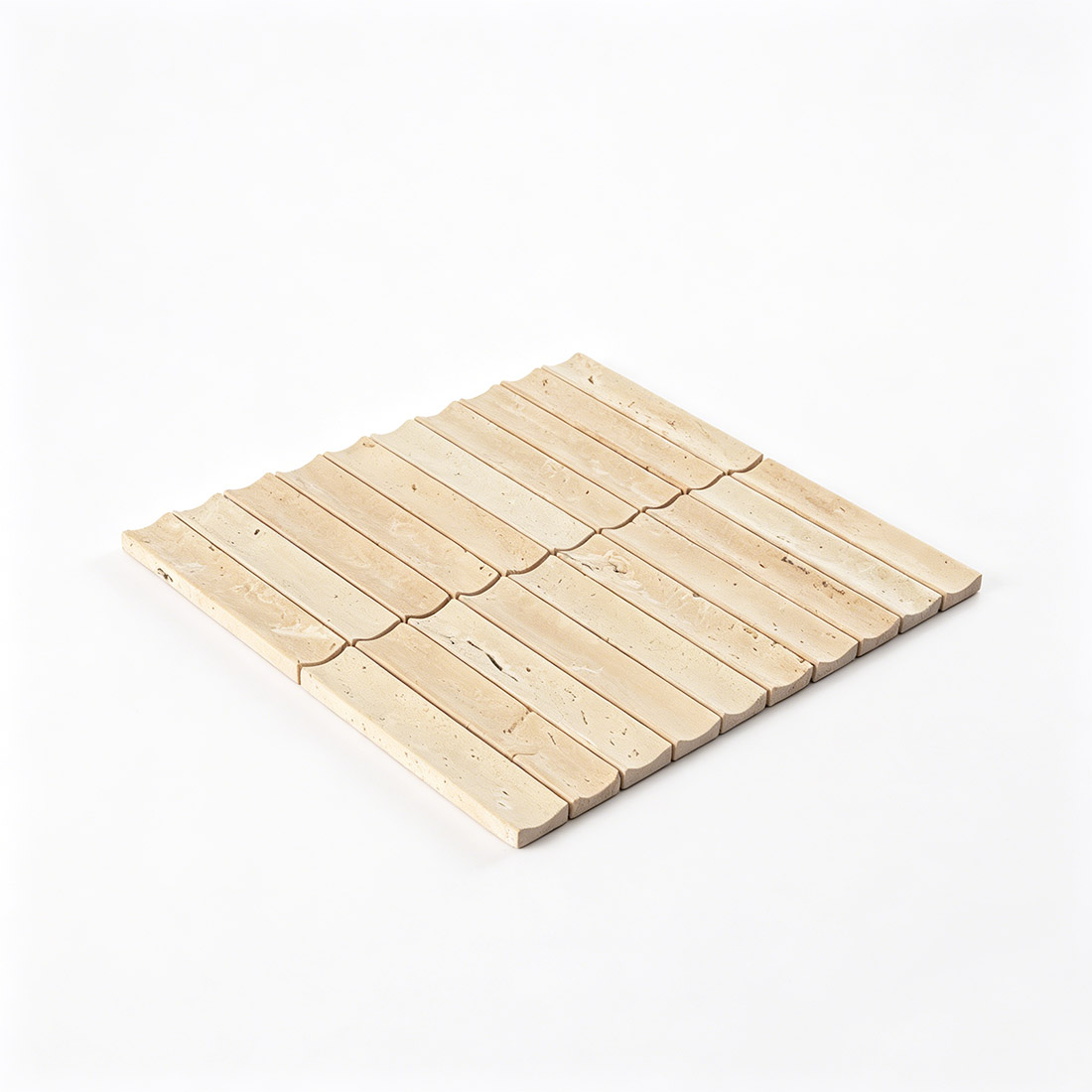 Angled view of beige travertine fluted linear mosaic.