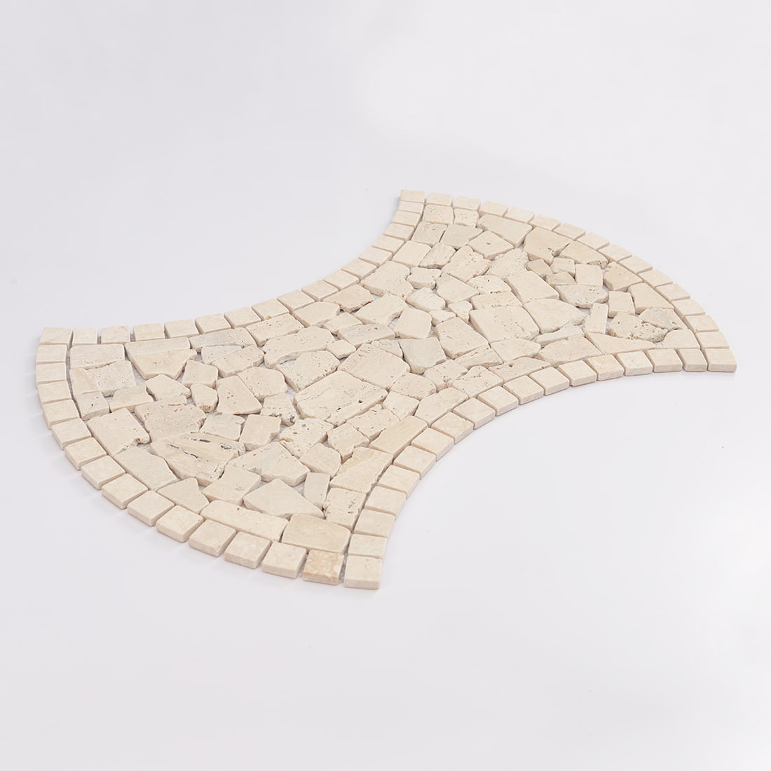 Angled view of beige travertine irregular mosaic tile with curved border