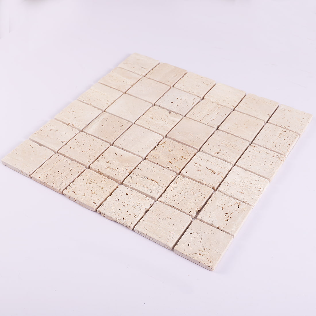 Perspective view of beige travertine square mosaic tile sheet