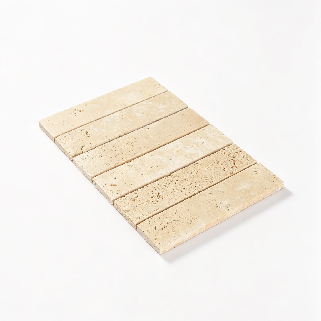 Perspective view of laid beige travertine strip mosaic tiles