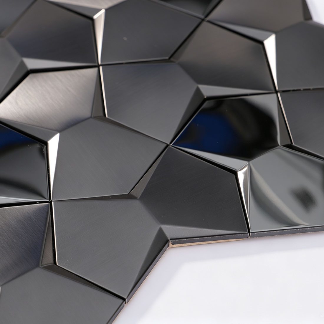 Glossy reflective light on 3D black faceted metallic mosaic tile