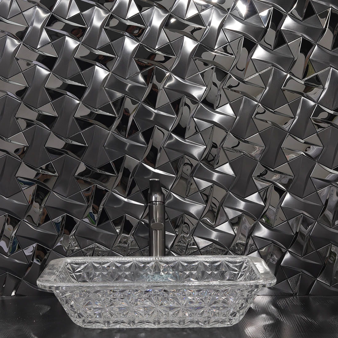 3D black metallic mosaic tile backsplash behind bathroom sink