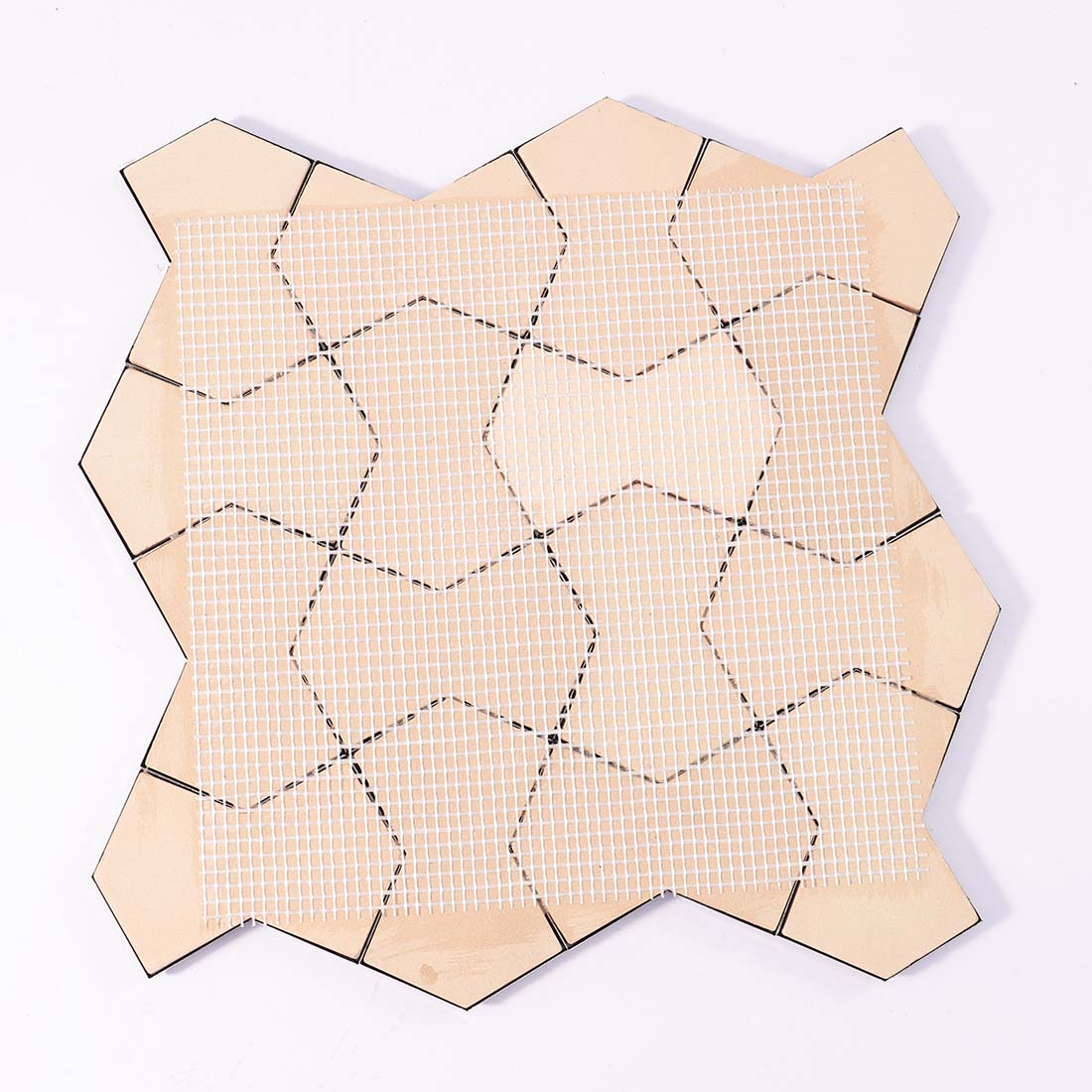 Mesh mounted backing of 3D black faceted metallic mosaic tile sheet