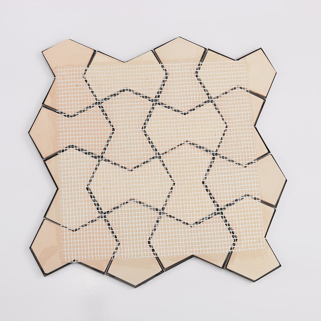 Mesh mounted backing of 3D black geometric metallic mosaic tile sheet