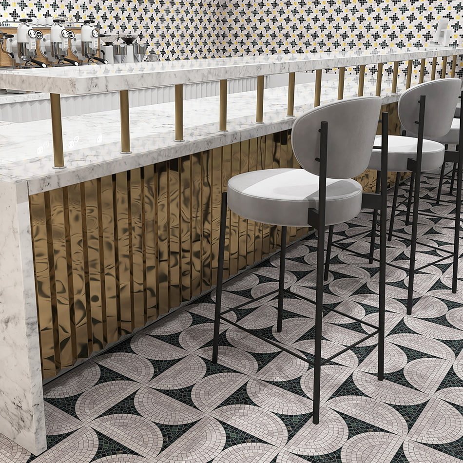 Modern bar interior with black and white marble mosaic floor tiles.