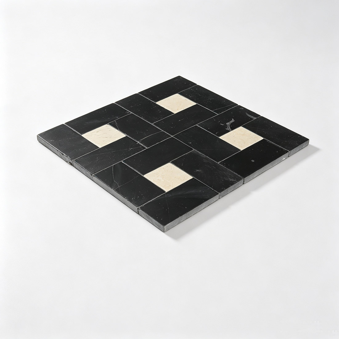 Perspective view of laid black and beige pinwheel marble mosaic