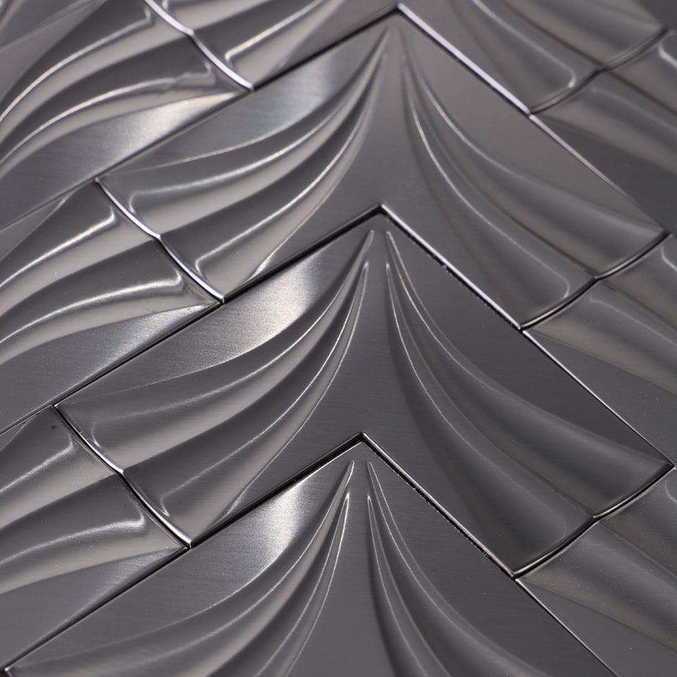 Close-up of black chevron metal mosaic tile surface