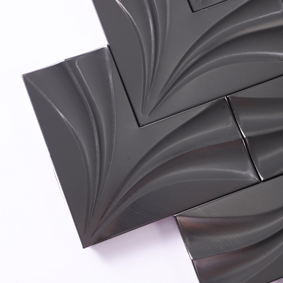 Corner detail of black chevron metal mosaic tile