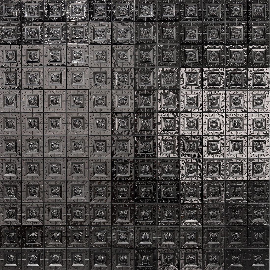 Full wall view of black embossed square metal mosaic tiles