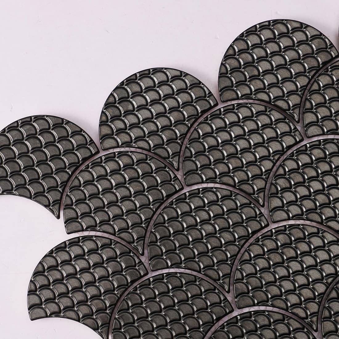 Pattern close-up of black fish scale metal mosaic tile