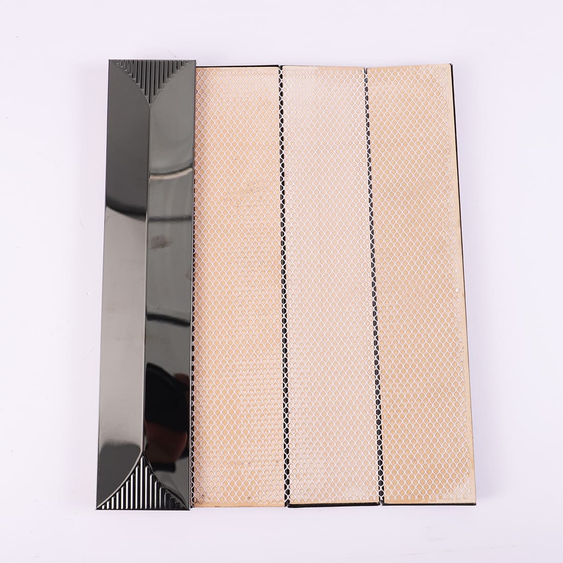 Back view of black glossy and ribbed stainless steel strip mosaic with mesh