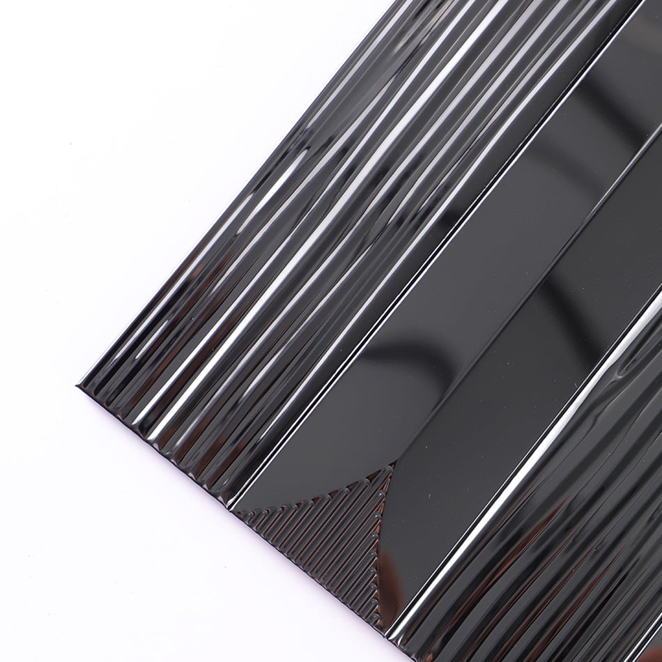 Corner detail of black glossy textured rectangular metal mosaic tile