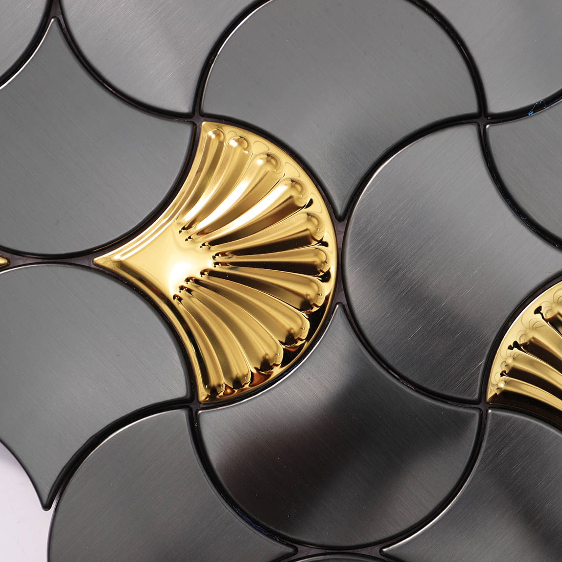 Surface texture detail of black and gold metallic mosaic tile