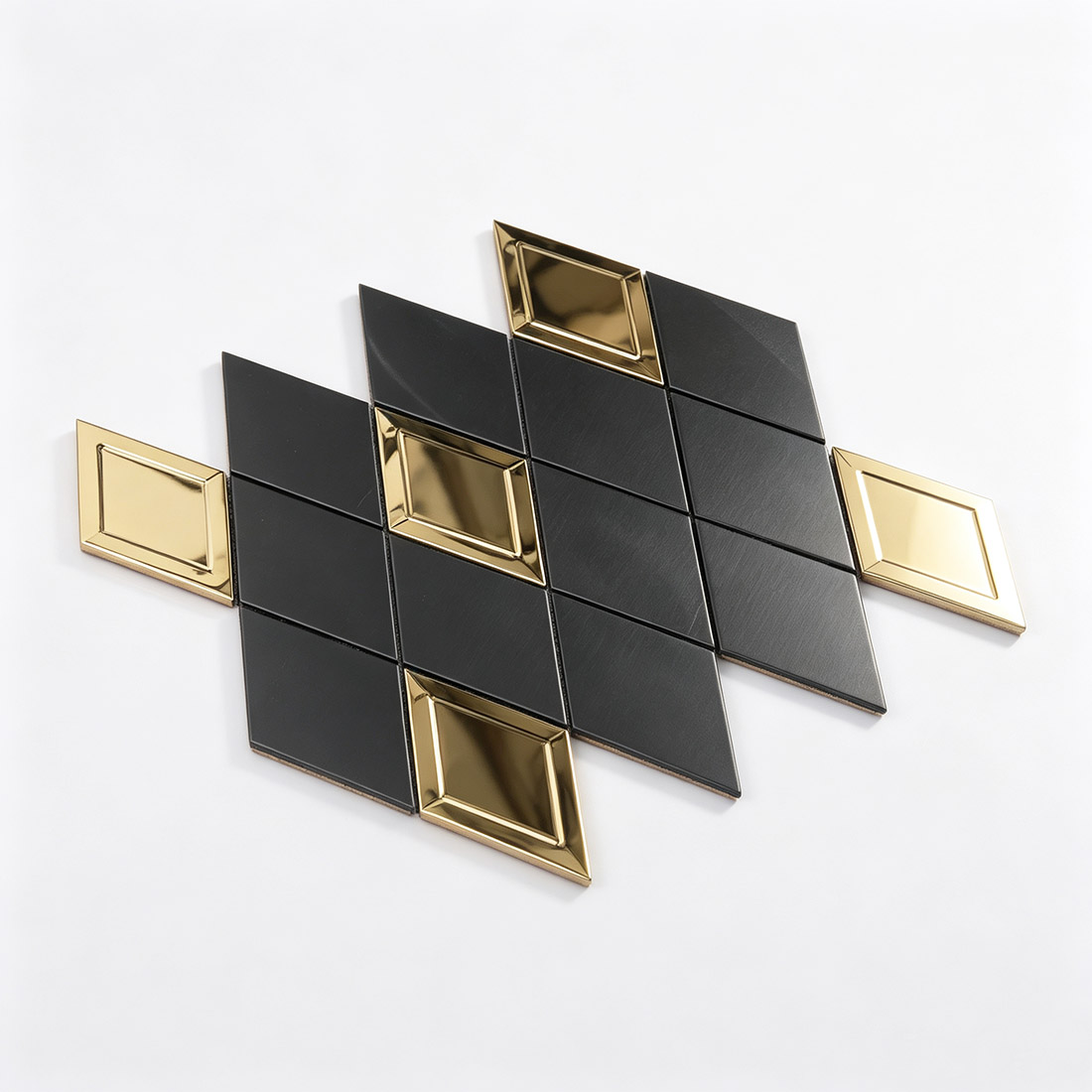 Perspective view of black brushed and polished gold rhombus metal mosaic tiles