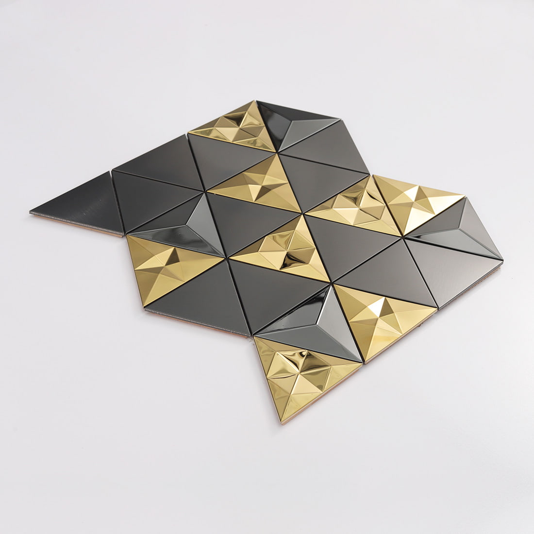 Black and gold triangle metal mosaic sheet with 3D geometric design