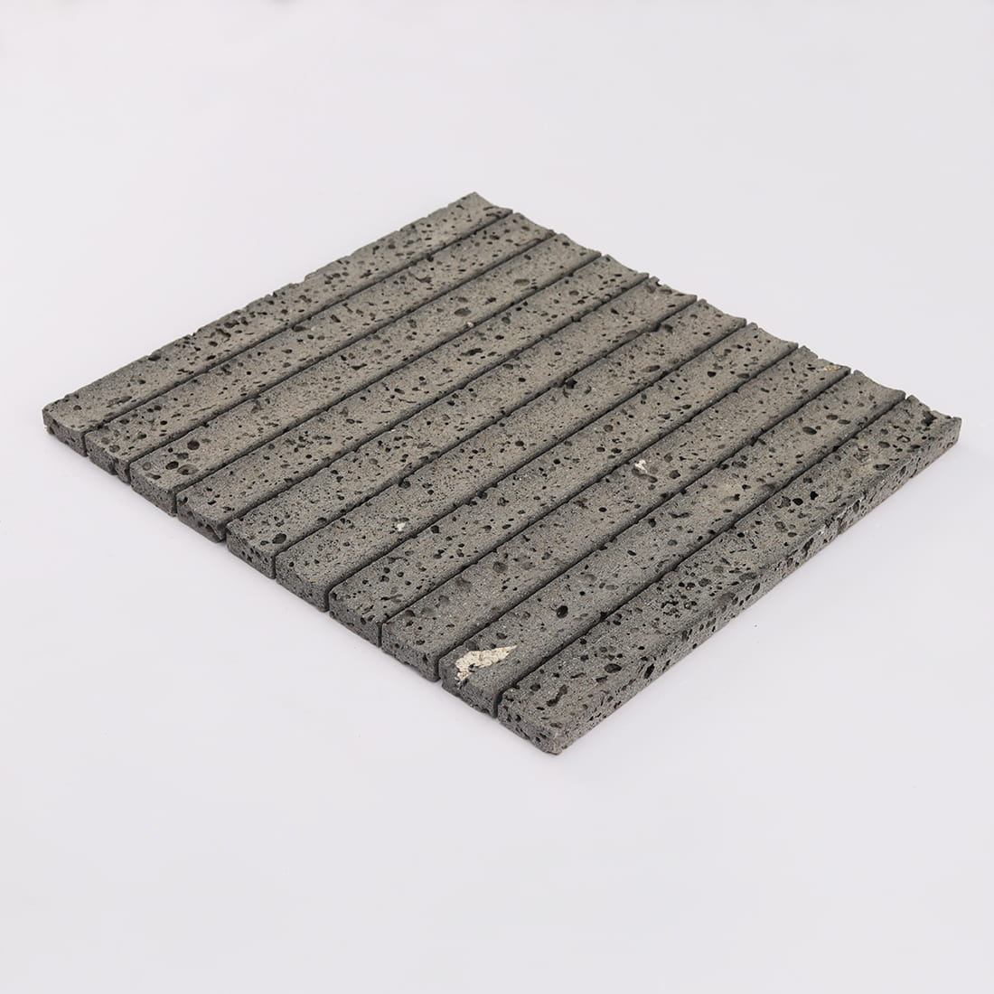Perspective view of black lava stone fluted mosaic tile sheet