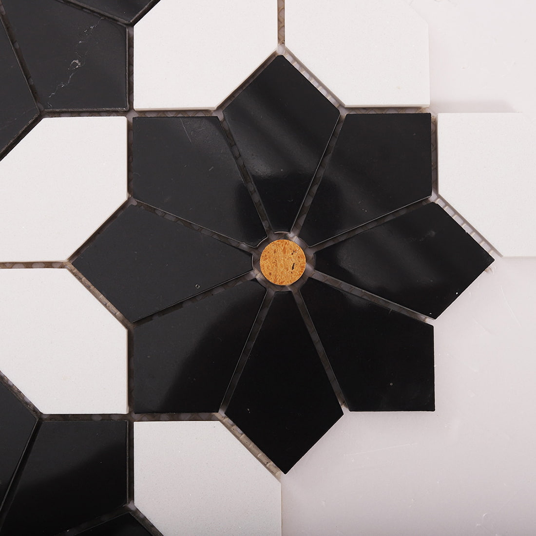 Close up detail of black and white octagon mosaic pattern and grout lines