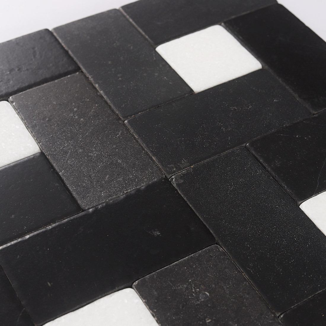 High angle view of black and white marble pinwheel mosaic texture
