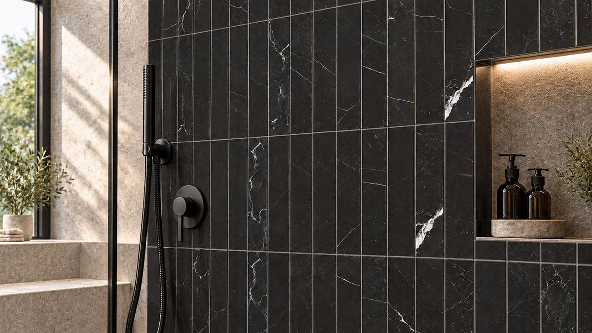 Black marble shower wall tiles with white veining and matte black fixtures