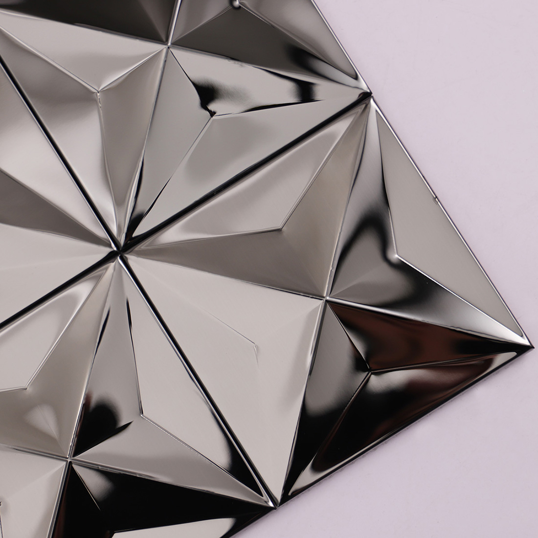 Close-up of black mirror 3D square stainless steel mosaic tile