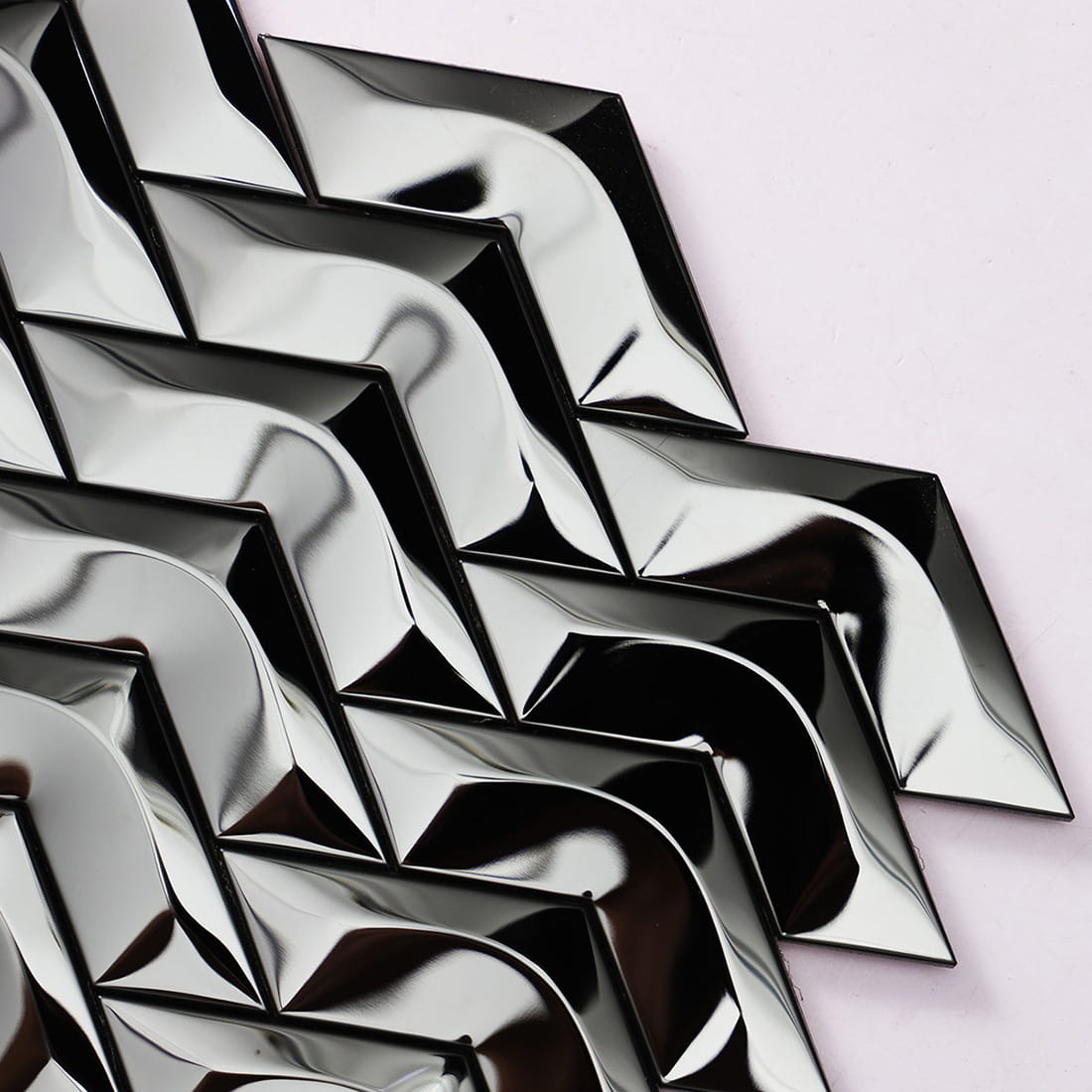 Close-up of black mirror chevron stainless steel mosaic tile