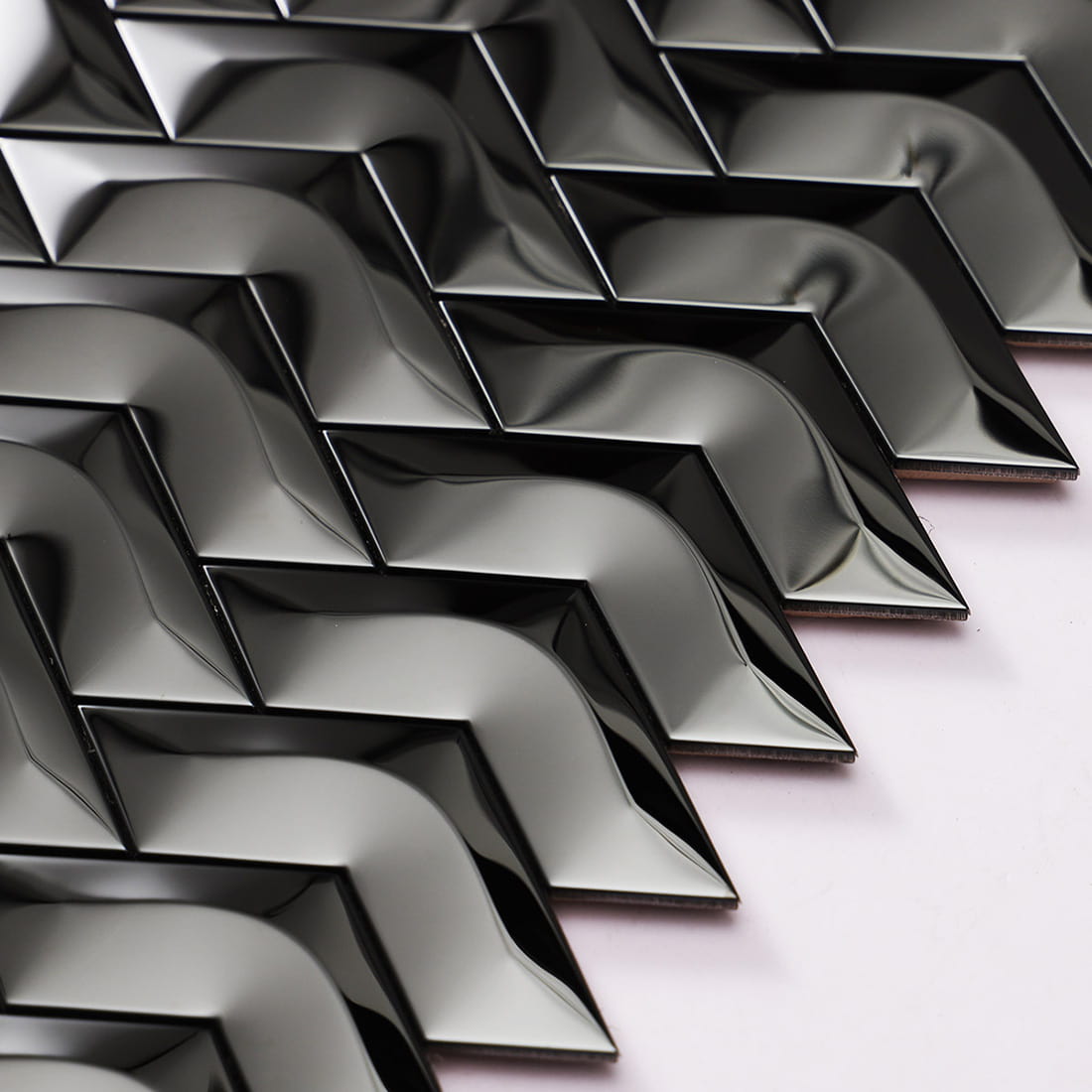 Detailed view of black mirror chevron stainless steel mosaic tile