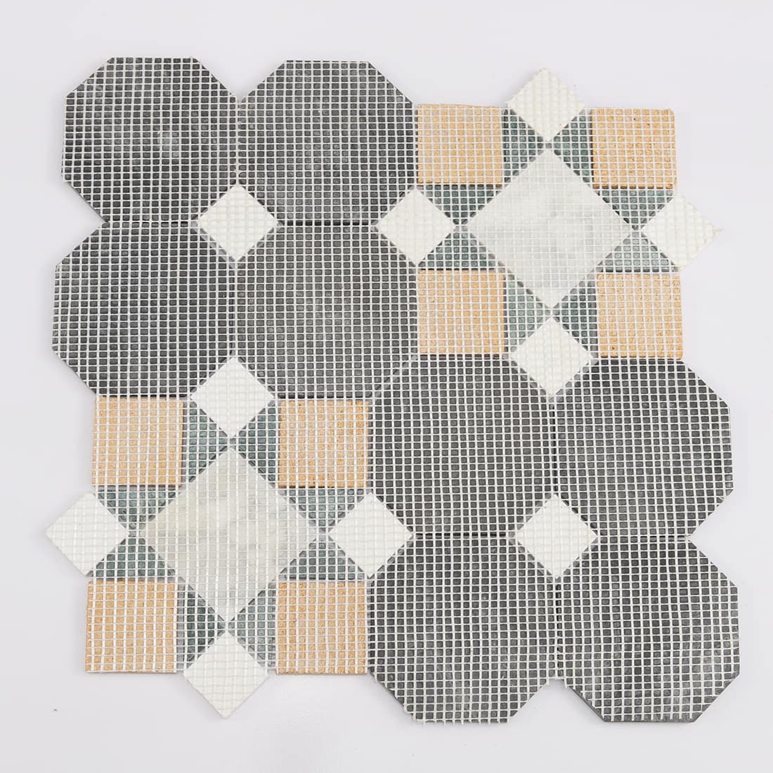Back view of black octagon marble mosaic tile sheet with mesh backing