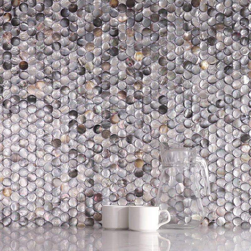 Black penny tiles made of natural shell mosaic for elegant interior wall decor.