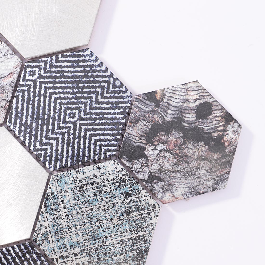 Close-up detail of black and silver geometric pattern hexagon aluminum tile