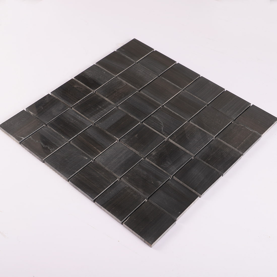 Perspective view of black square marble mosaic sheet
