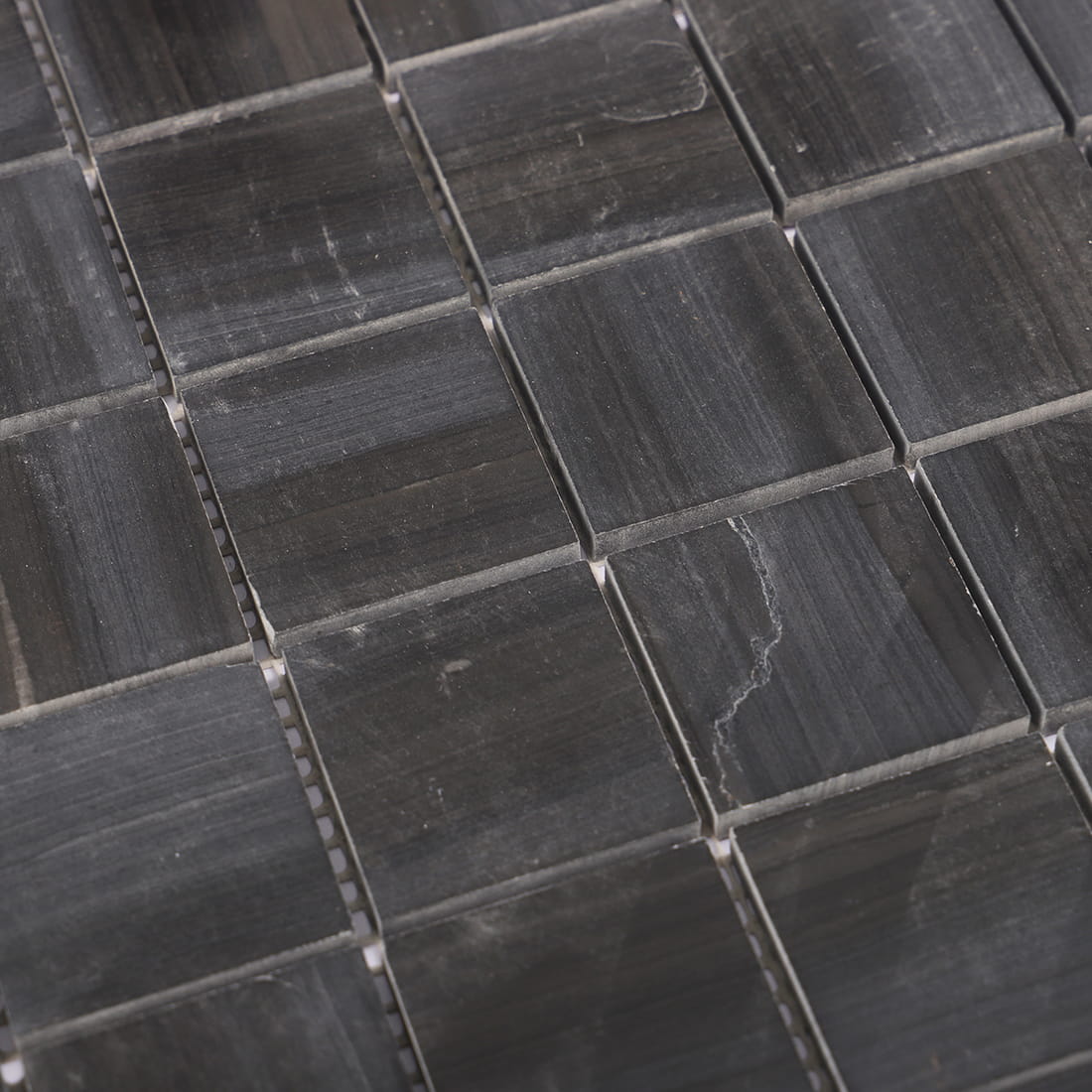 Close-up of black square marble mosaic tile texture