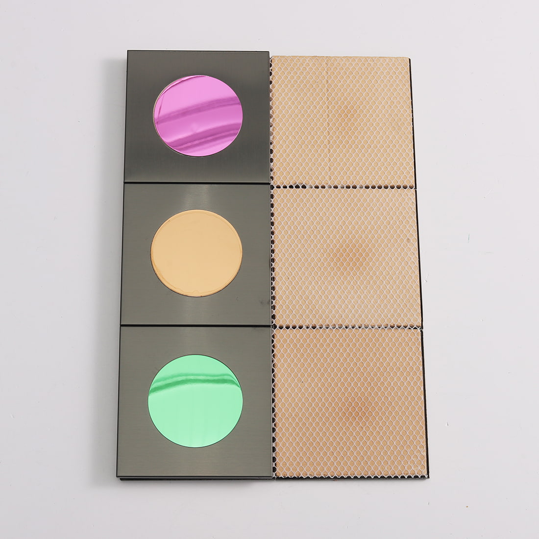 Back mesh view of black square mosaic with pink gold and green circle inserts