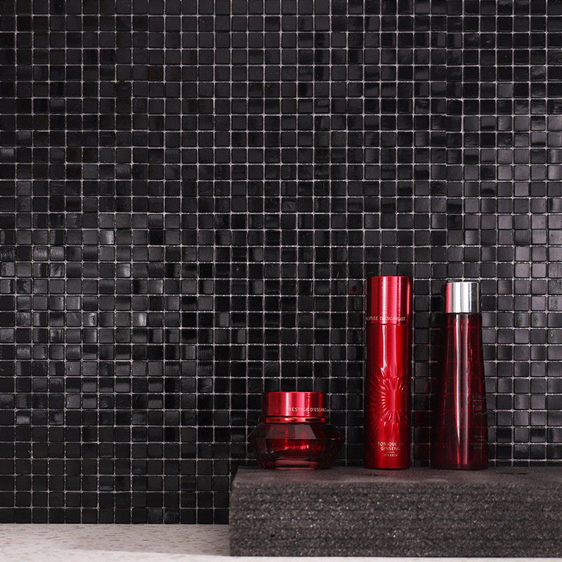Black square tiles in a glossy mosaic pattern for luxury bathroom wall decor.