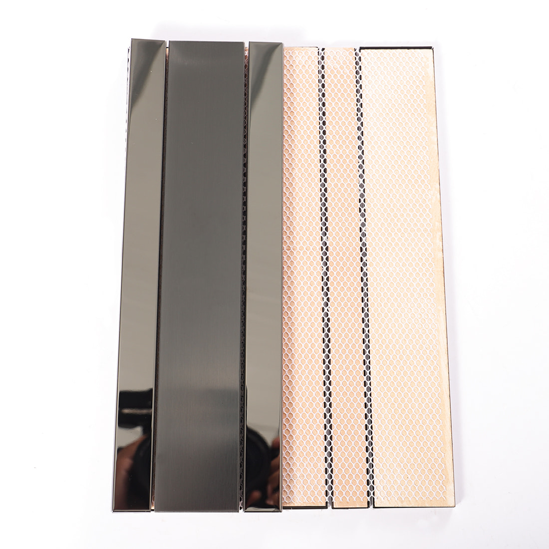 Back view of black strip metal mosaic tile sheet