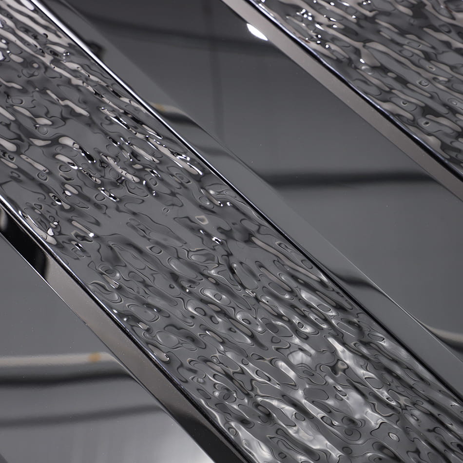 Close-up of black textured and glossy metal mosaic tile surface