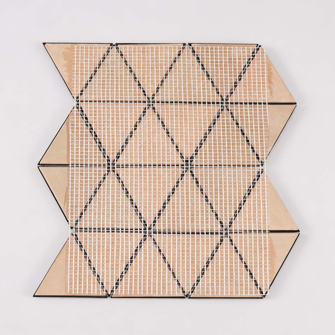 Back view of mesh mounted black triangle metal mosaic sheet