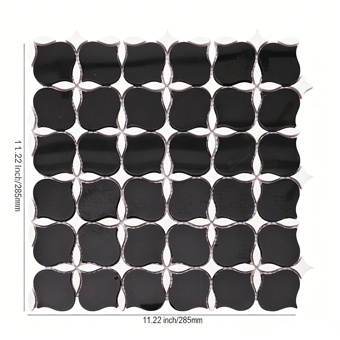 Black and white arabesque marble mosaic tile sheet with flower pattern.