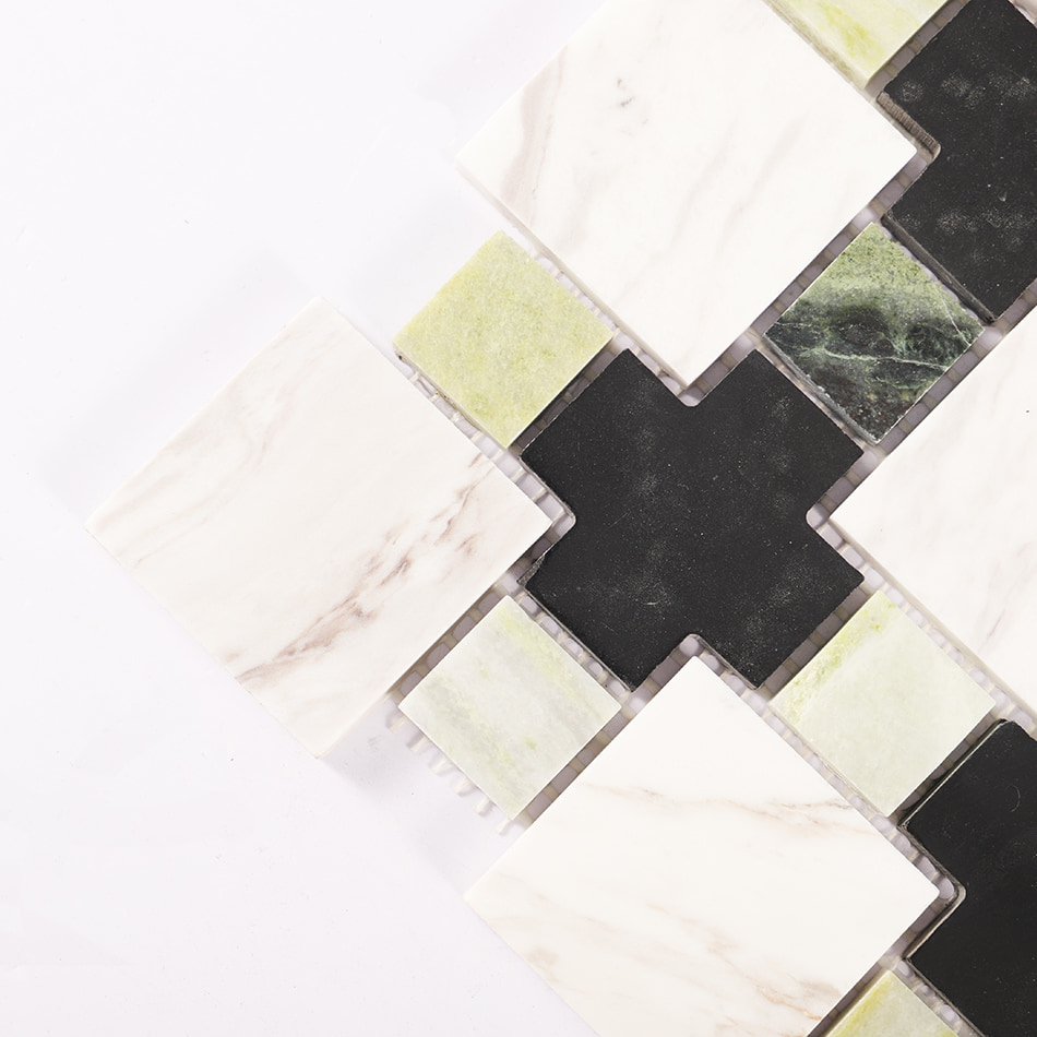 Corner detail of black white and green marble mosaic tile pattern