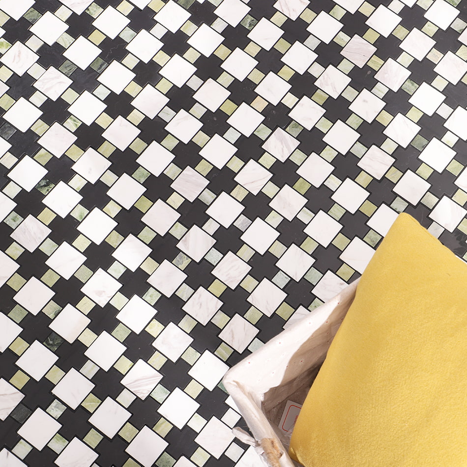 Top view of black white and green marble mosaic tile flooring