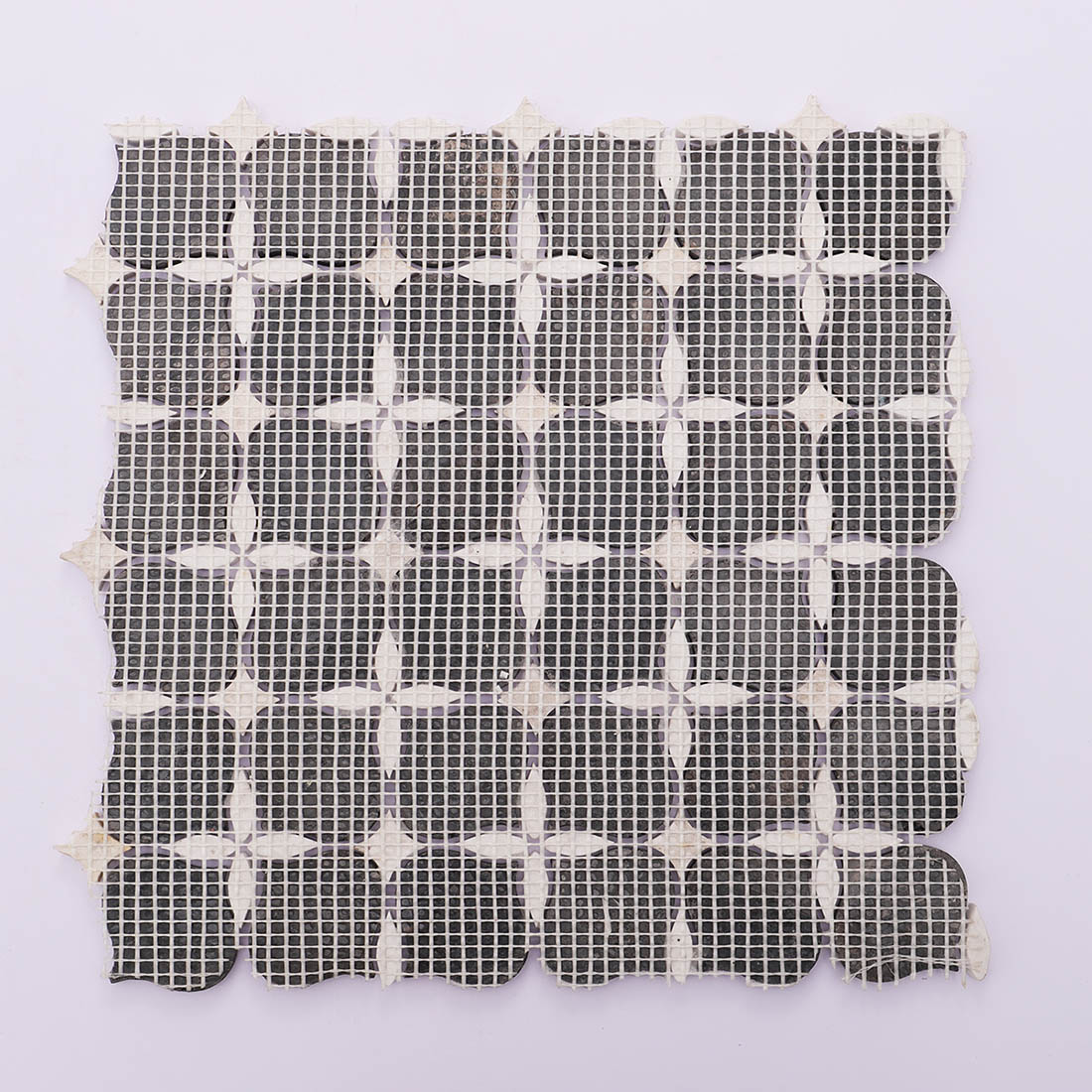 Black and white marble mosaic tile back view with mesh mounted backing.