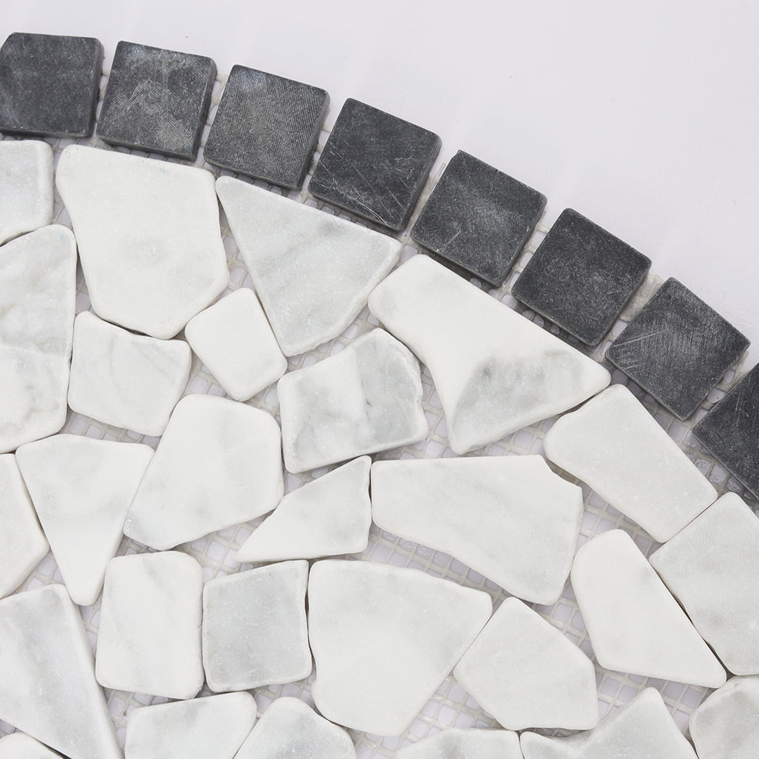 Close up of black and white pebble marble mosaic pieces