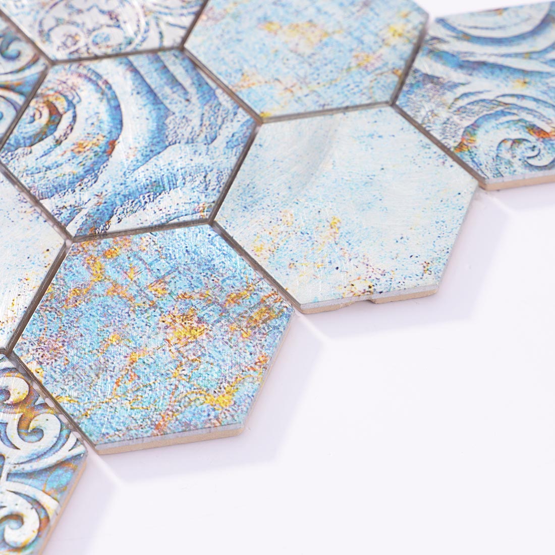 Angle shot of blue hexagon mosaic tile showing metallic aluminum edge