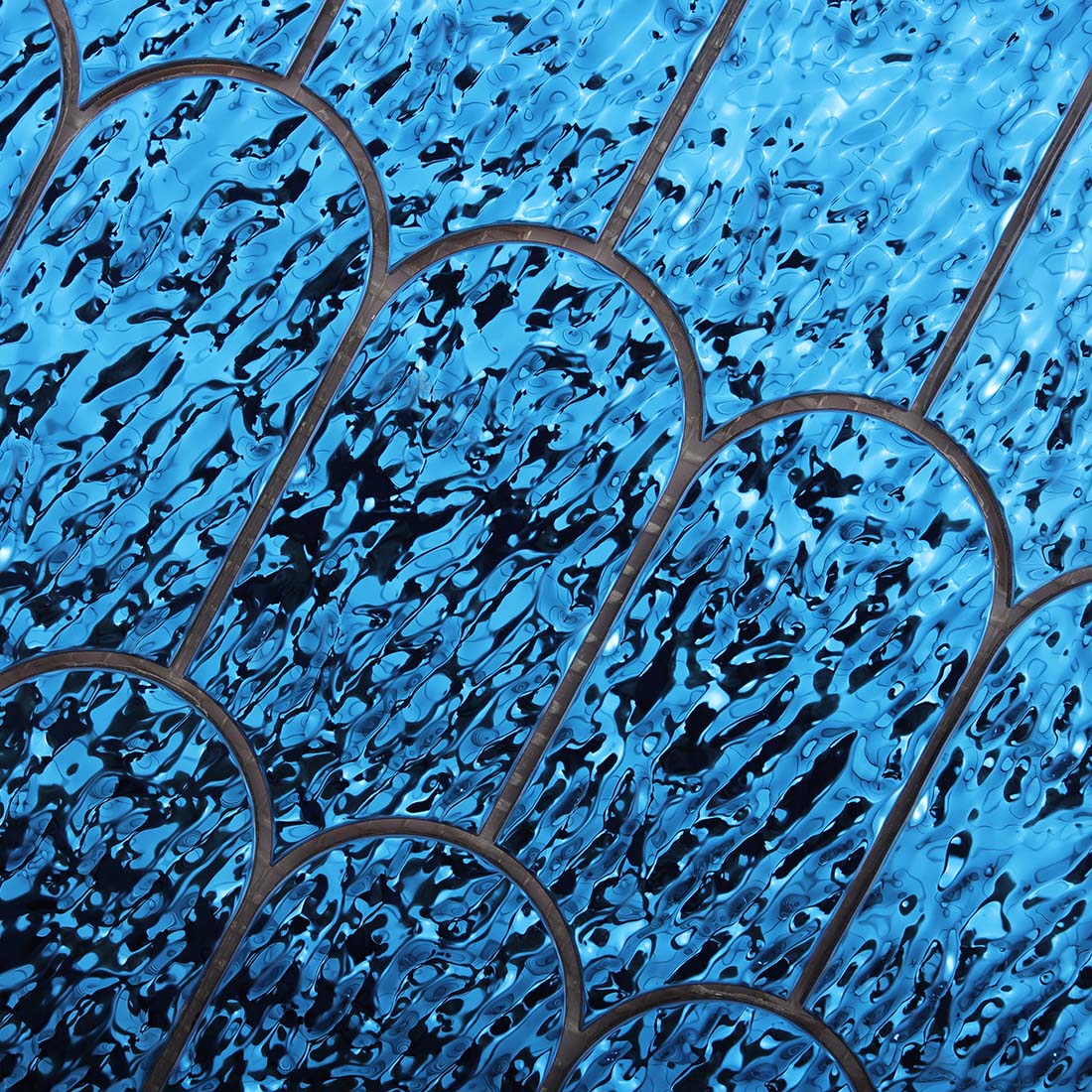 Top view showing water ripple texture on blue mermaid tail tile