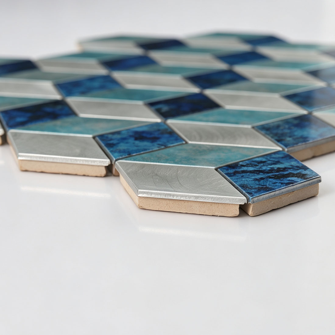 Side view of blue turquoise aluminum cube mosaic tile showing thickness and finish
