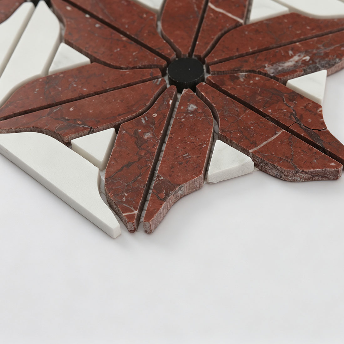 Raised botanical marble mosaic surface with burgundy petals and ivory accents