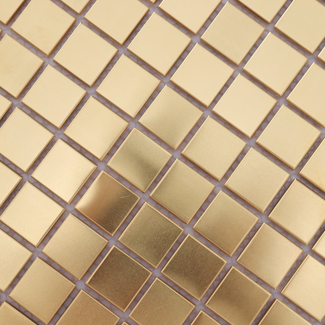 Close up of brass square metal mosaic tile surface