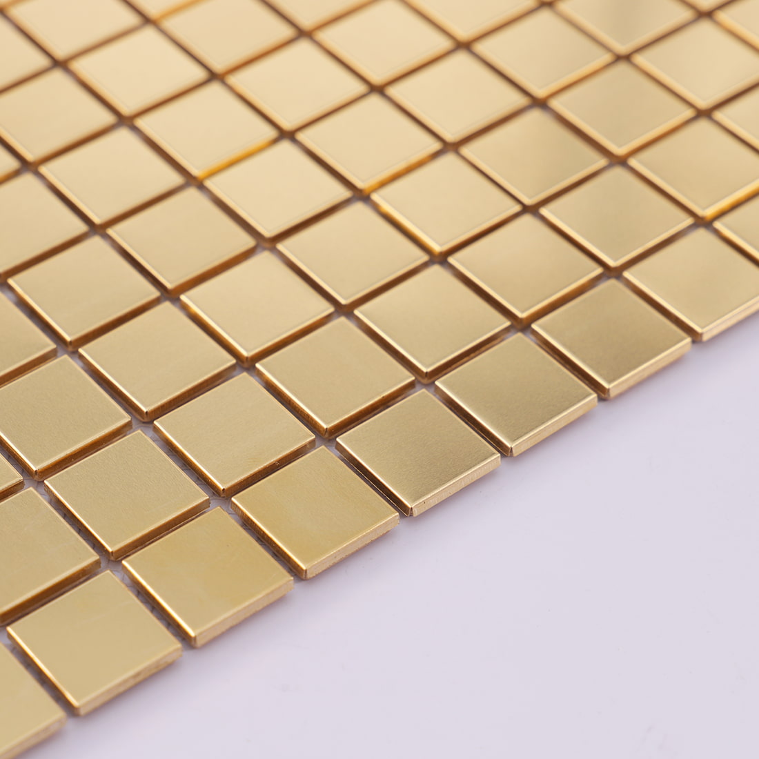 Edge detail of brass square metal mosaic tile sheet