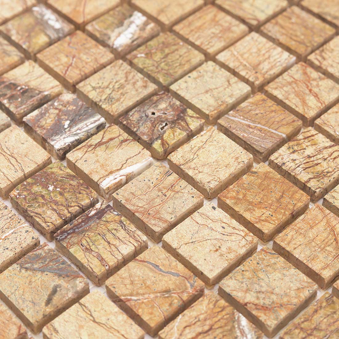 Detailed view of polished beige and brown marble square mosaic tile pieces