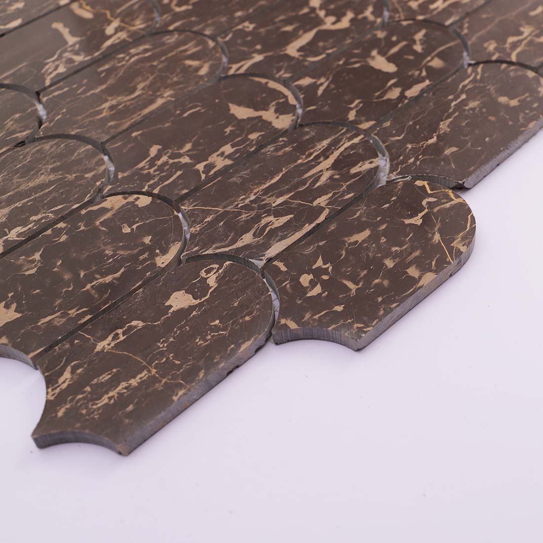 Side view showing thickness and edge of brown marble mosaic tile